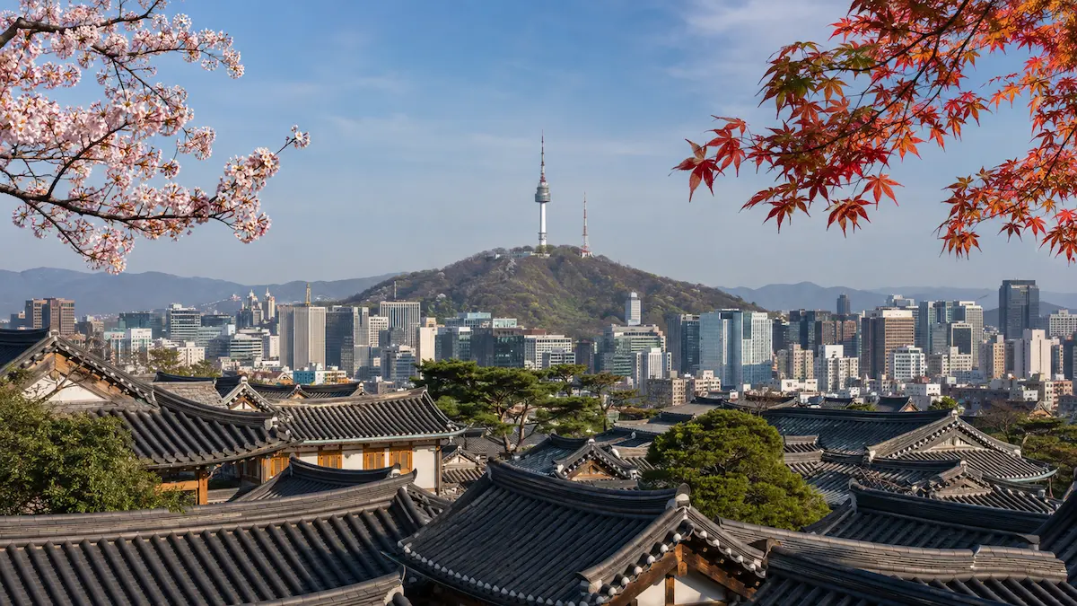 Seoul in spring and autumn with N Seoul Tower and traditional hanok rooftops
